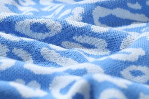 Texture of bright knitted fabric with pattern as background, closeup Foto stock