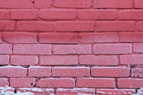 Texture of bright red brick wall on a frost day. Stock Photos