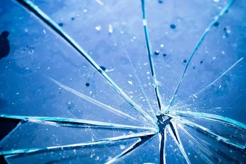 Texture of broken glass in blue light Stock Photos