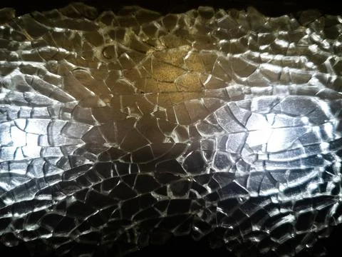 Texture broken glass window. shards highlighted. close-up Фото