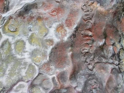 The texture of the bronze surface with dents. Stock Photos