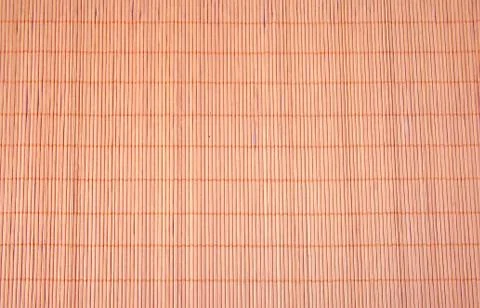 Texture of brown bamboo tablecloth close up. Stock Photos