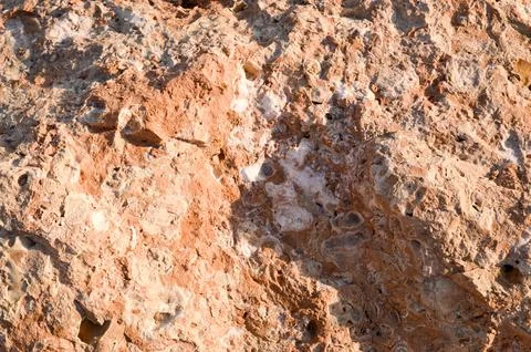 The texture of a brown, bulging, sharp porous chest of stone stone with salt  Stock Photos