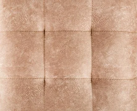 Texture brown fabric. Background of a soft pouf. Stock Photos