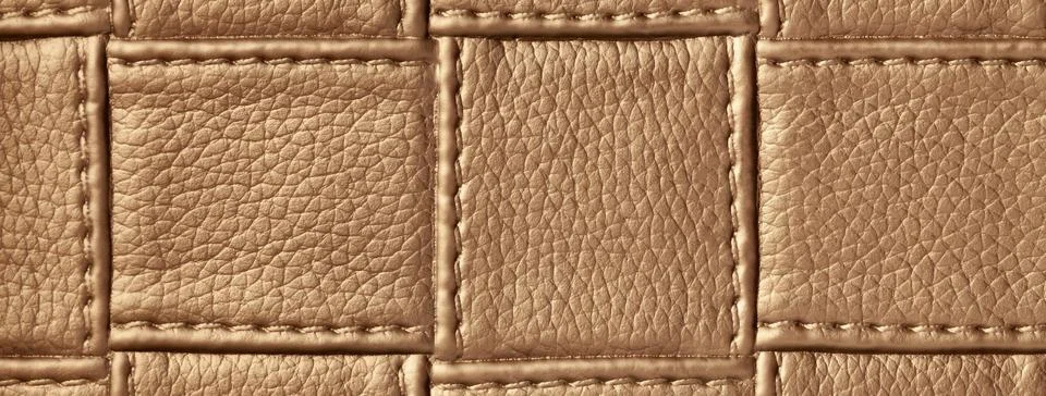 Texture of brown leather background with square pattern and stitch, macro. Stock Photos