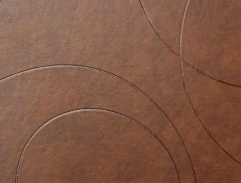 Texture of brown leather surface with embossed elements, full frame Stockfoto's