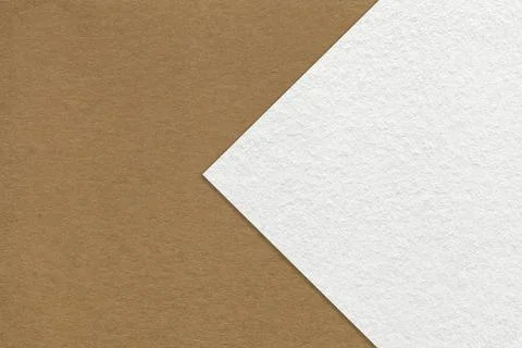 Texture of brown paper background, half two colors with white arrow, macro. Stock Photos