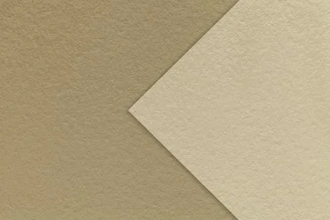 Texture brown paper background, half two colors with beige arrow, macro. Stockfoto's