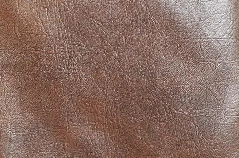The texture of brown skin, background, material. Stock Photos