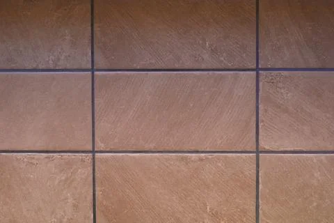 Texture of brown tile with dark grout joints Stock Photos