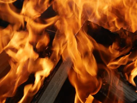 The texture of a burning campfire is close. You can see the wood Stock Photos