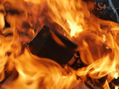 The texture of a burning campfire is close. You can see the wood Stock Photos