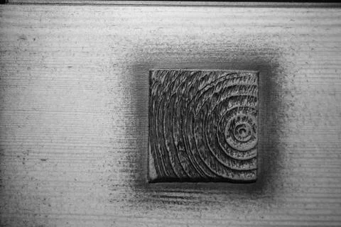 Texture of a butt cut of a tree on a background of a wooden board. Stock Photos