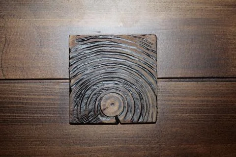 Texture of a butt cut of a tree on a background of a wooden board. Stock Photos