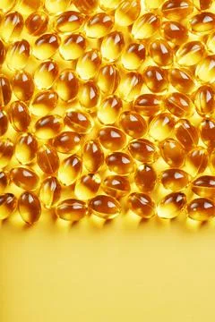 The texture of the capsules in the shell with liquid vitamin D3 in full scree Stock Photos