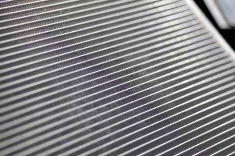 The texture of the car radiator. Engine cooler background. Stock Photos