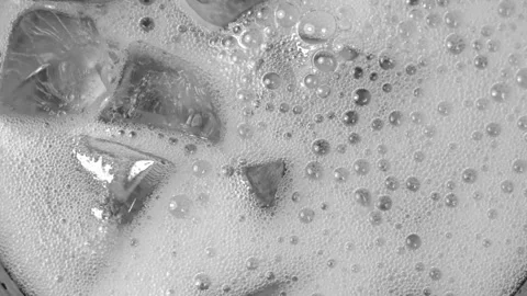 Texture of carbonate drink with bubbles in glass. Stock Footage 304404856