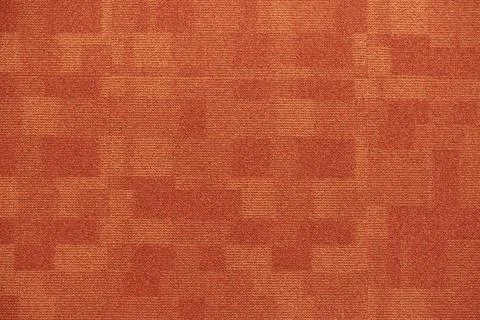 Texture carpet covering, red with a pattern of squares Stock Photos