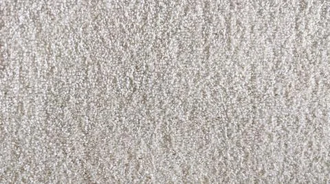 The texture of the carpet, textiles. White, Beige. Stock Photos