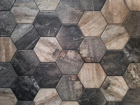 The texture of the ceramic tiles in the form of a hexagon made of brown natural Stock Photos