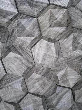 The texture of the ceramic tiles in the form of a hexagon made of natural sto Stock Photos