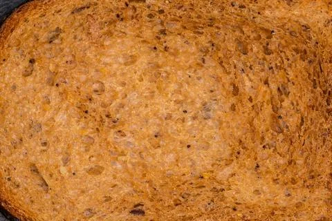 Texture of cereal brown bread slice, top view close-up Stock Photos