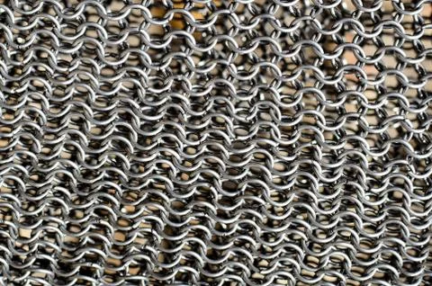 Texture of chainmail. Metallic texture, macro background. Stock Photos