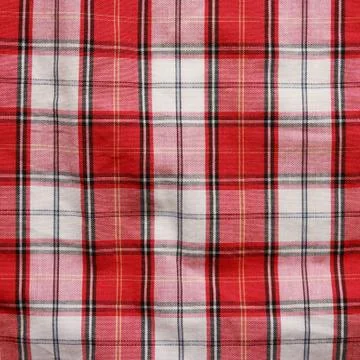 Texture of checkered picnic blanket. Red linen crumpled tablecloth. Stock Photos