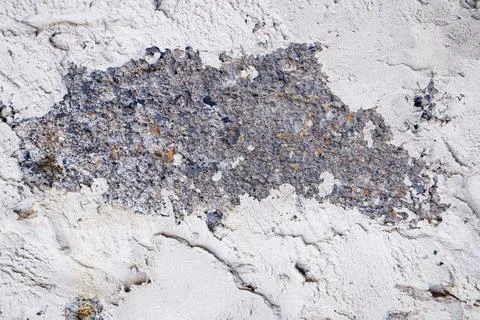 The texture of the cinder block is plastered with plaster around the edges. Stock Photos