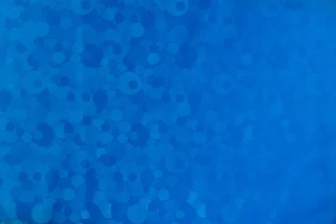 Texture with circles and stripes on a blue plastic tablecloth Stock Photos