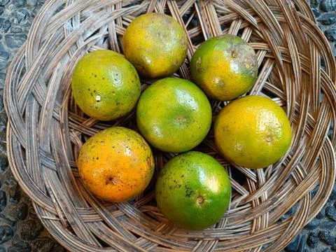Texture of citrus fruit in a wicker plate Stock Photos