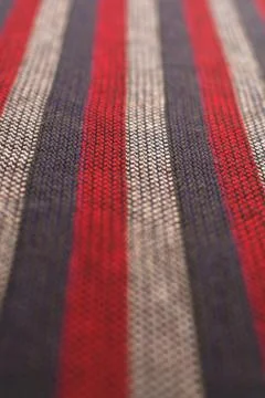 Texture close up of a red, gray and white striped wool cloth. Stock Photos