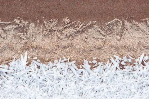 Texture closeup of sand and ice crystals hoarfrost Stock Photos