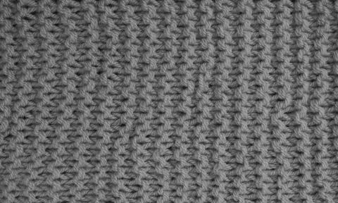 Texture of clothes from woolen threads close-up. Stock Photos