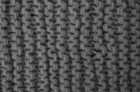 Texture of clothes from woolen threads close-up. Stock Photos
