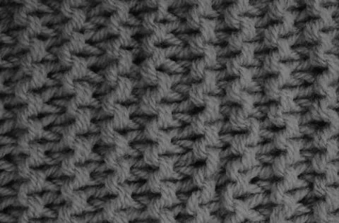 Texture of clothes from woolen threads close-up. Stock Photos