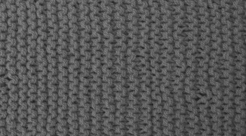 Texture of clothes from woolen threads close-up. Stock Photos