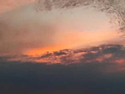 The texture of the clouds is colorful reddish orange in the afternoon Stock Photos