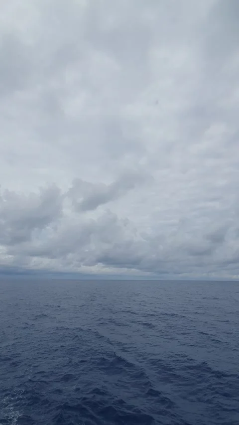 Texture of clouds in the sky over a choppy ocean Stock Footage 297647407
