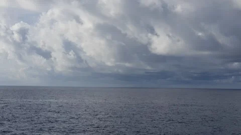 Texture of clouds in the sky over a choppy ocean Stock Footage 297674552