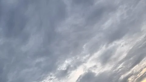 Texture of cloudy gray clouds with varying white clouds Stock Photos