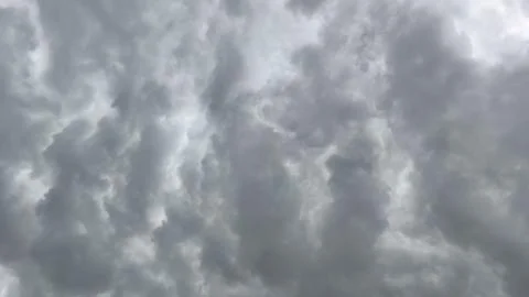 Texture of cloudy gray clouds with varying white clouds Stock Photos