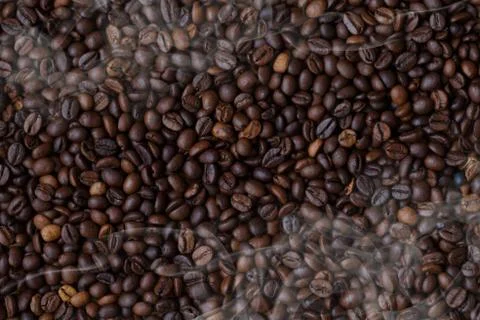 Texture of coffee beans and hot vapor Stock Photos