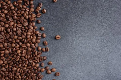 Texture of coffee beans on a dark gray background Stockfoto's