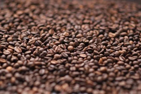 Texture of coffee beans. side view. macro photo Stock Photos