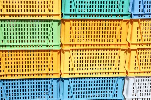 Texture from colored plastic colored yellow blue green rectangular boxes with Foto stock