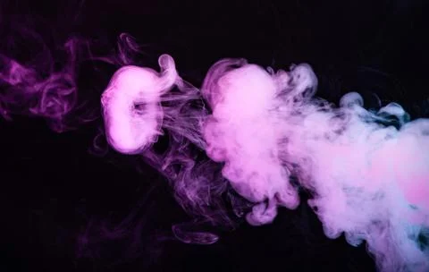 Texture of colored smoke on a black background . Stock Photos