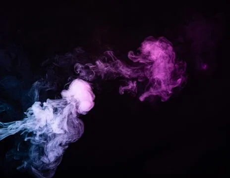 Texture of colored smoke on a black background . Stock Photos