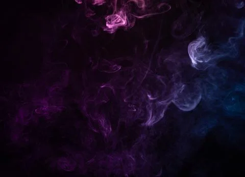 Texture of colored smoke on a black background . Stock Photos