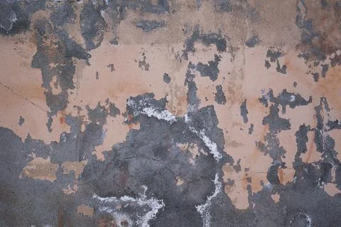 Texture of concrete wall covered with old broken stucco Stock Photos